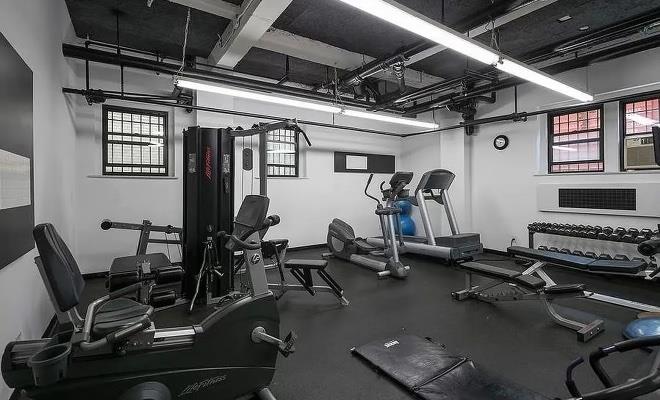 333 East 53rd Street, Unit 6B Manhattan, NY 10022 - Photo 7 of 15 a room with gym equipment