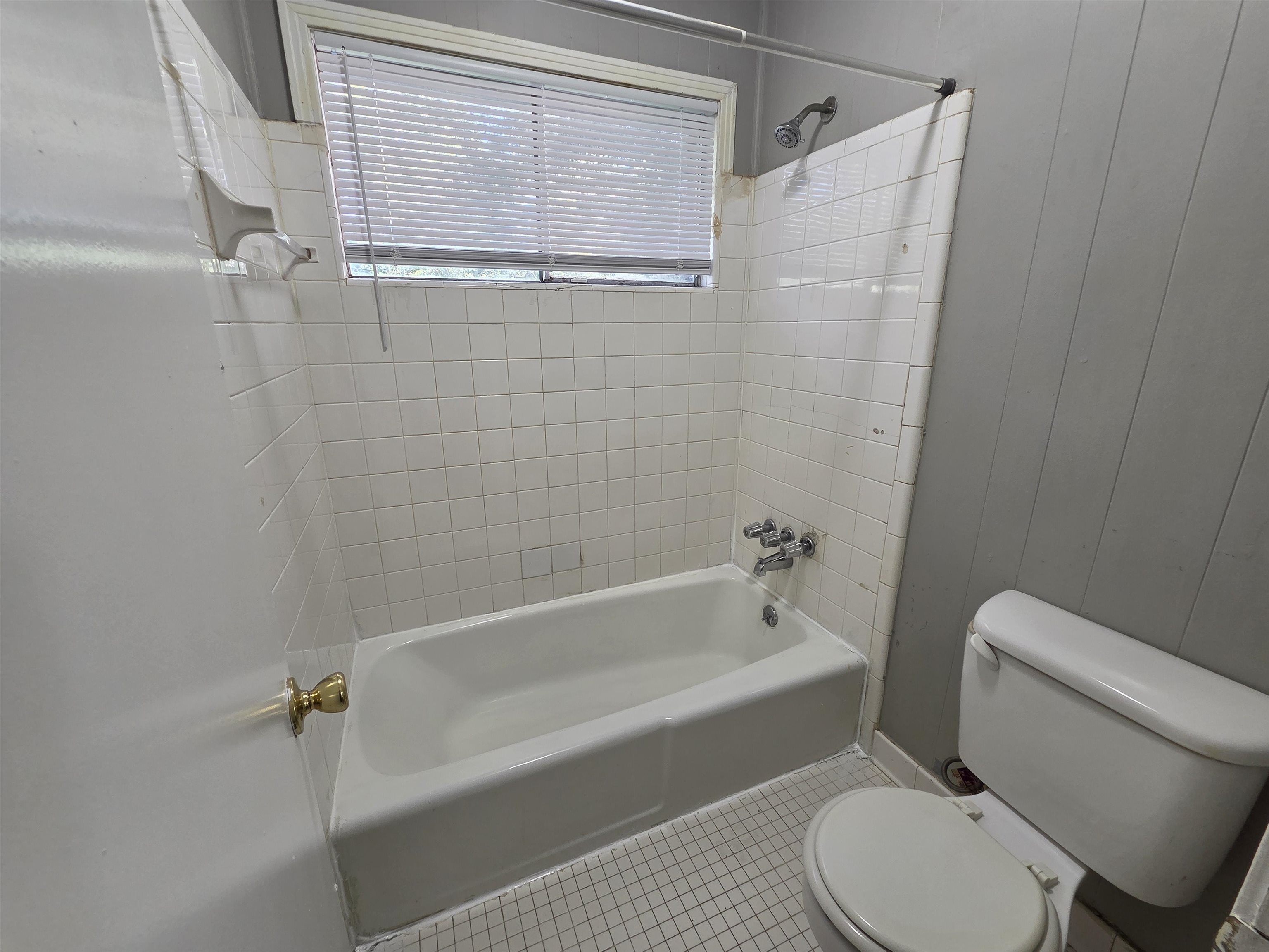 4573 Appleville Street Memphis, TN 38109 - Photo 18 of 22 a bathroom with a toilet and a shower