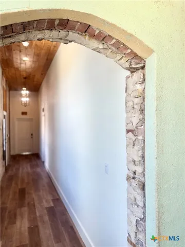 a view of a glass door with wooden floor