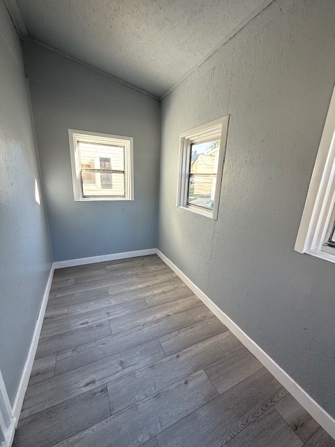 406 South Division Avenue Polo, IL 61064 - Photo 6 of 13 an empty room with wooden floor and windows