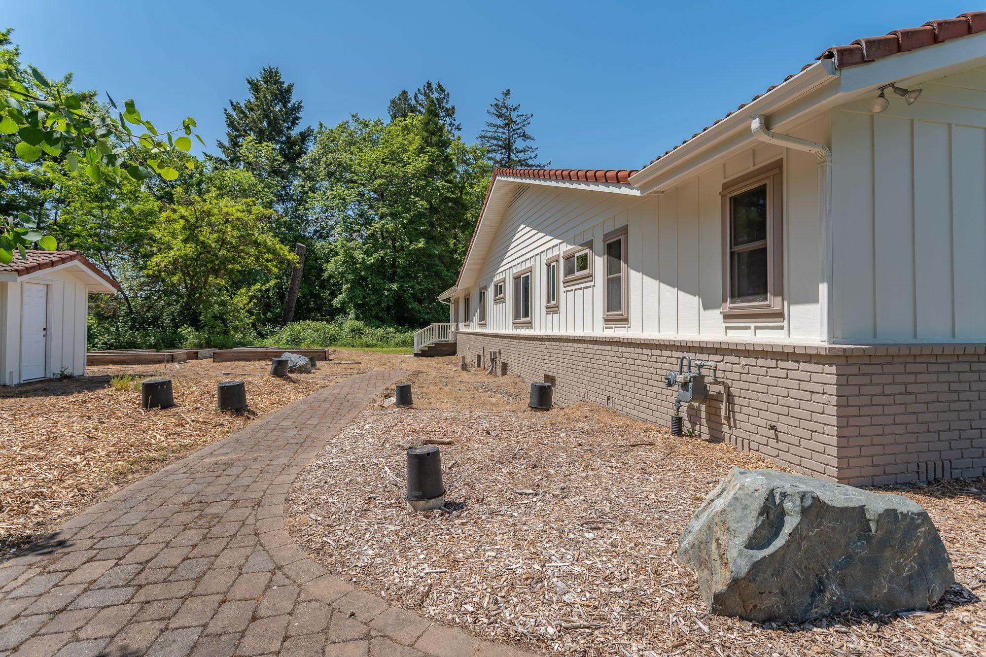 3134 South River Road Grants Pass, OR 97527 - Photo 30 of 38 a view of a back yard with a house