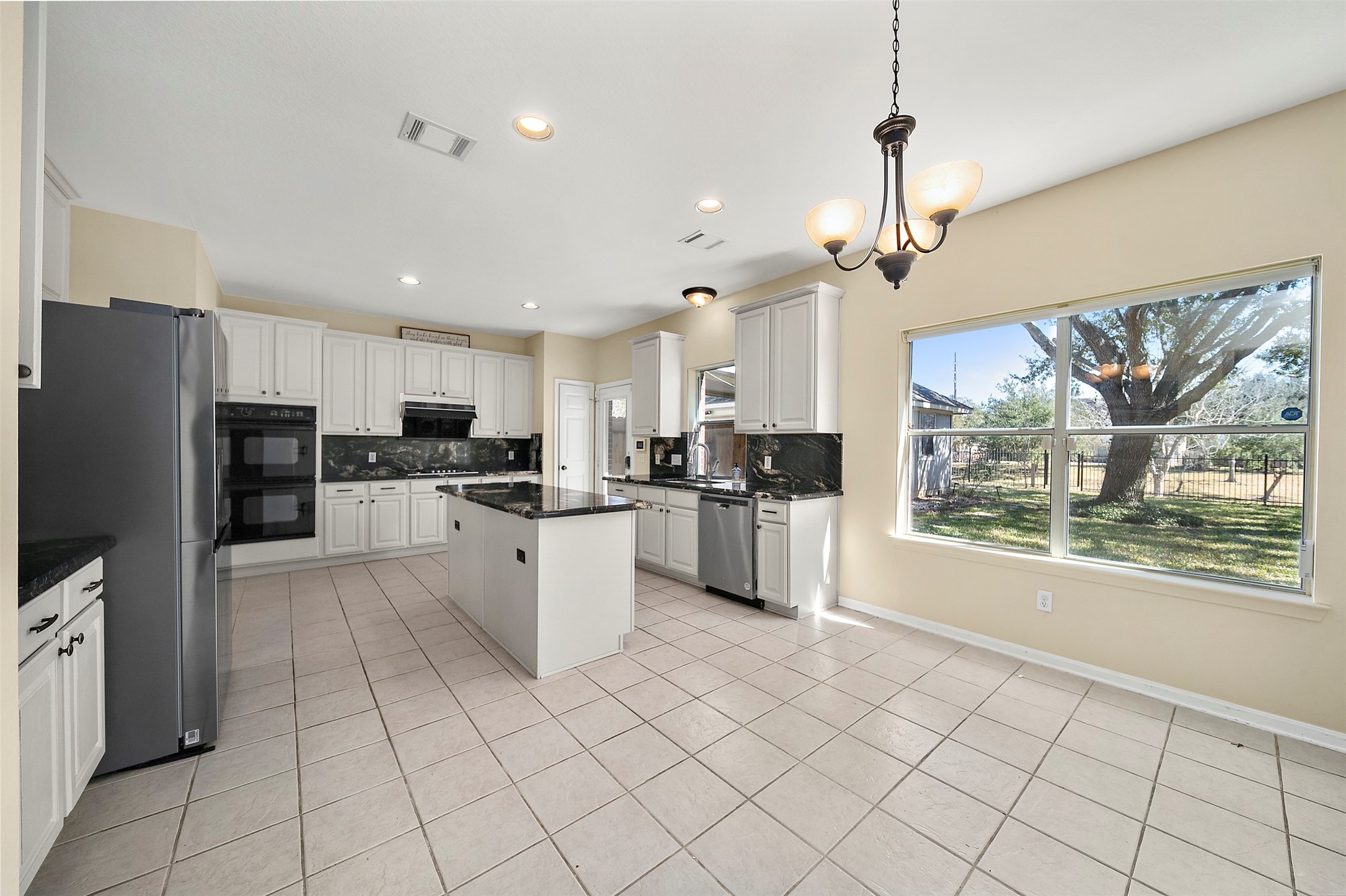 2627 Brazos Ridge Drive Sugar Land, TX 77479 - Photo 12 of 35 a large kitchen with cabinets and stainless steel appliances