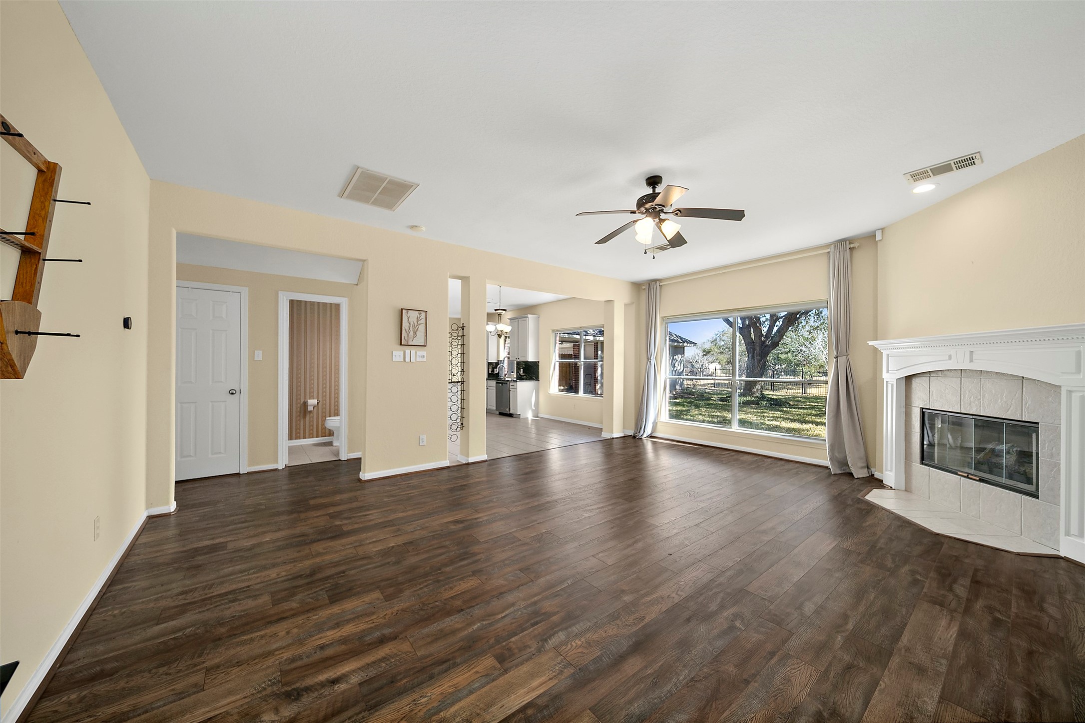 2627 Brazos Ridge Drive Sugar Land, TX 77479 - Photo 15 of 35 a view of an empty room with a fireplace and a window