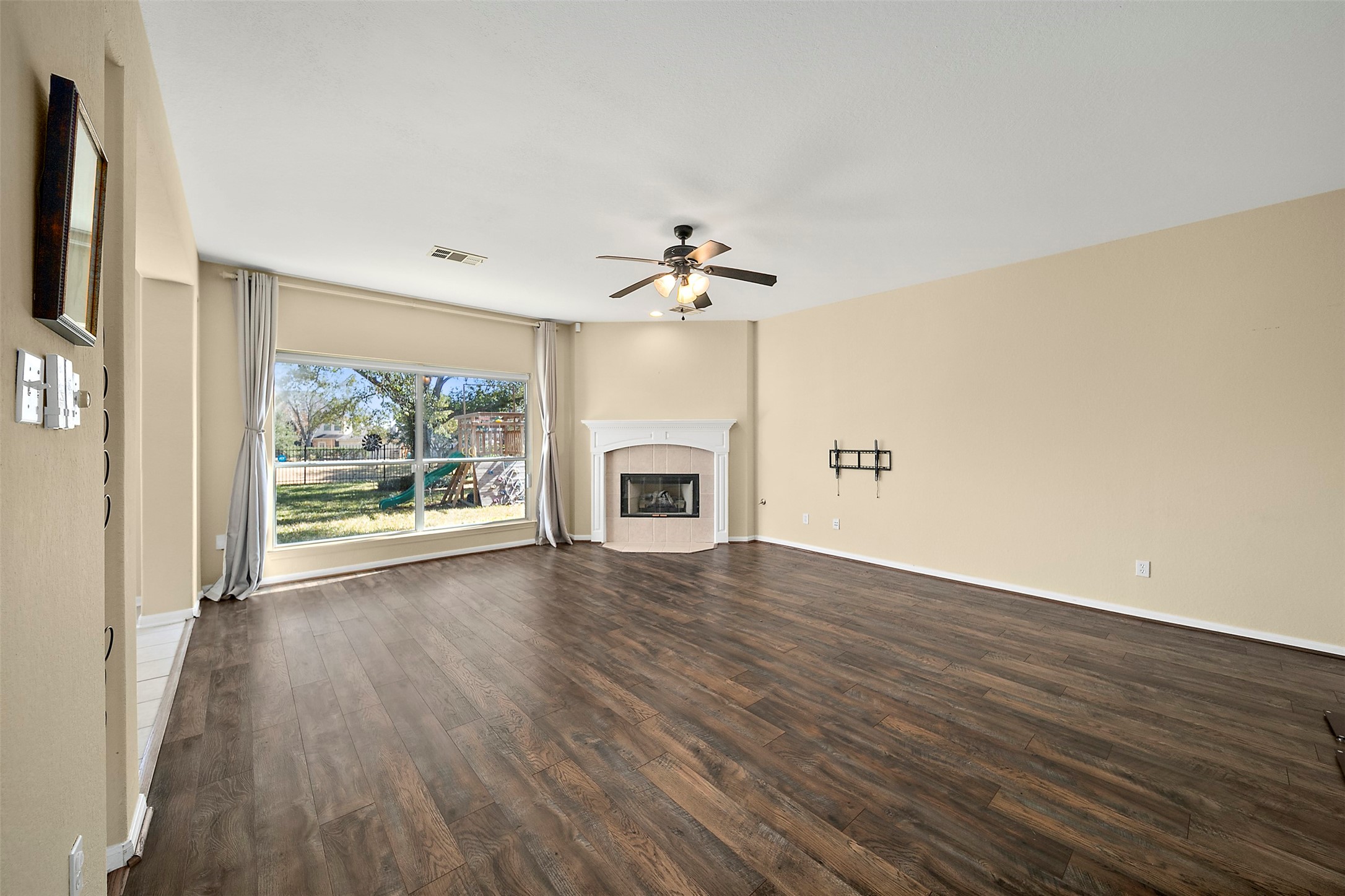 2627 Brazos Ridge Drive Sugar Land, TX 77479 - Photo 16 of 35 wooden floor chandelier and windows in a room