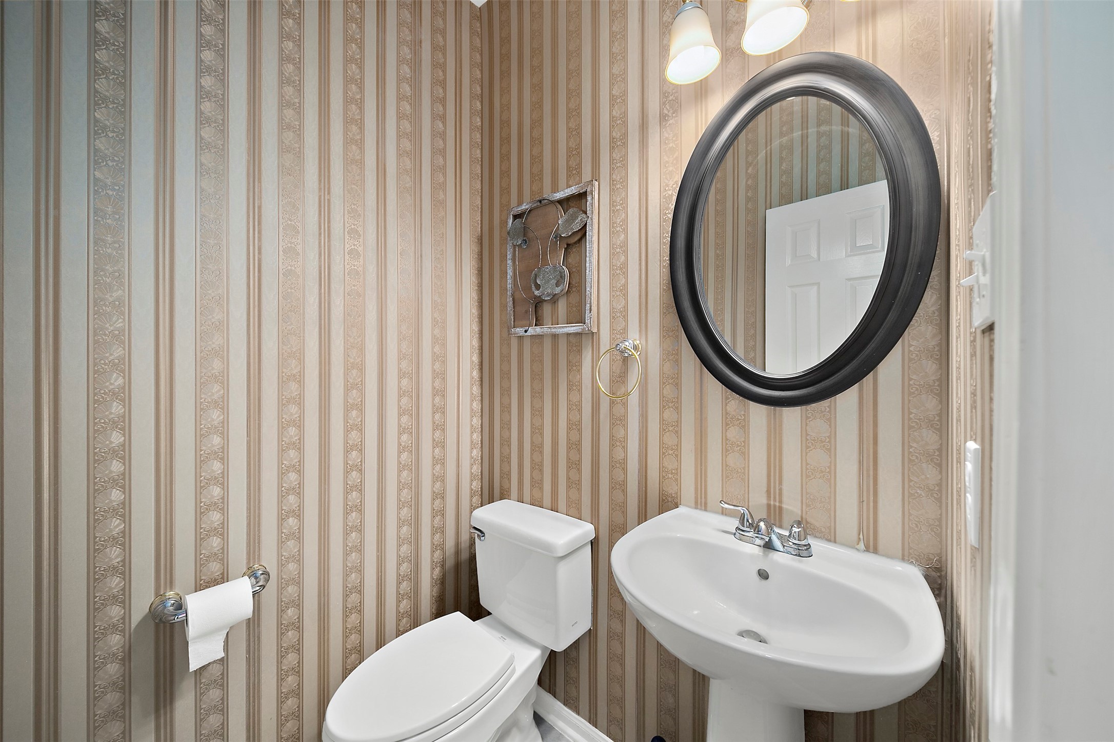 2627 Brazos Ridge Drive Sugar Land, TX 77479 - Photo 27 of 35 a bathroom with a sink a mirror and a toilet