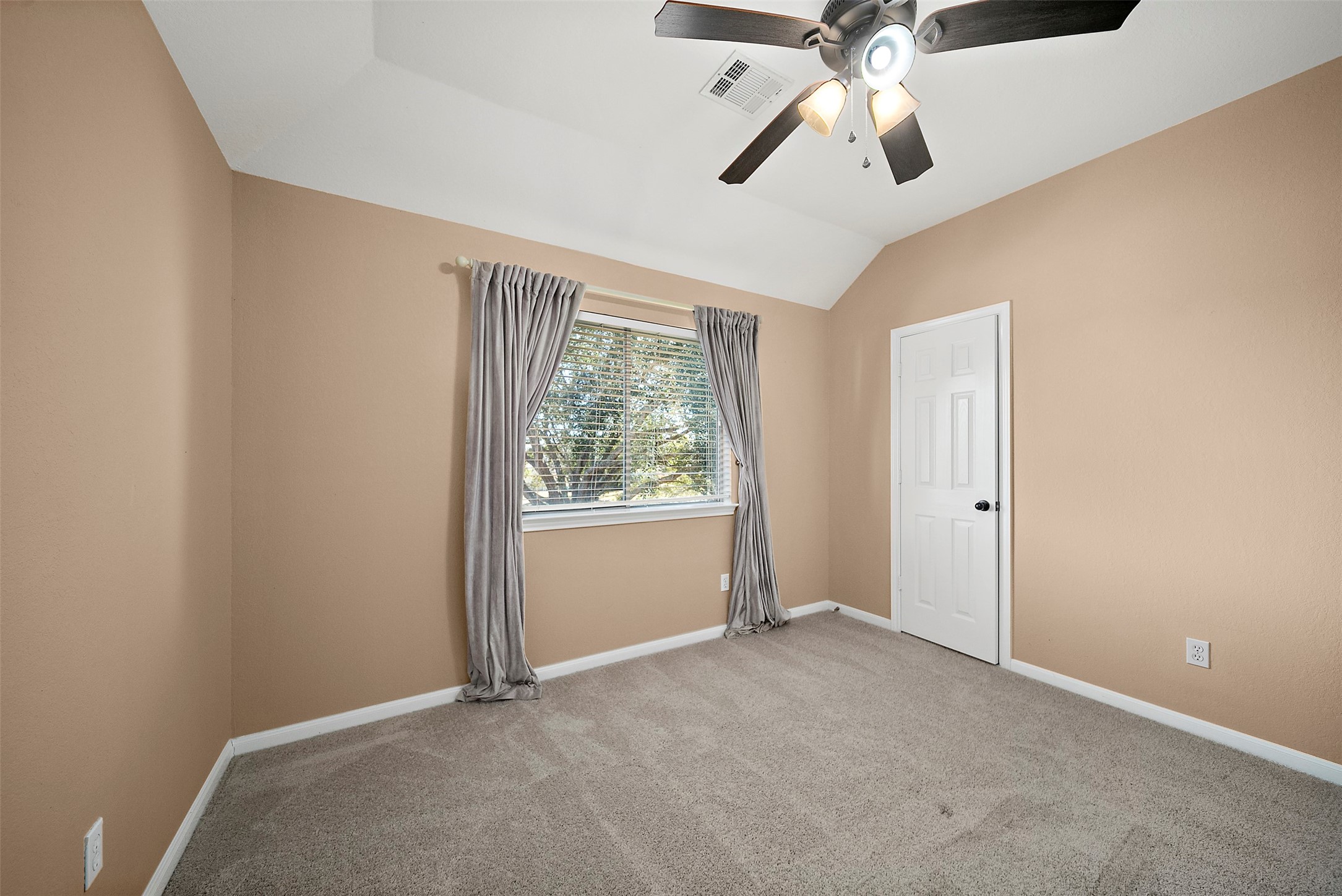 2627 Brazos Ridge Drive Sugar Land, TX 77479 - Photo 30 of 35 an empty room with chandelier fan and windows
