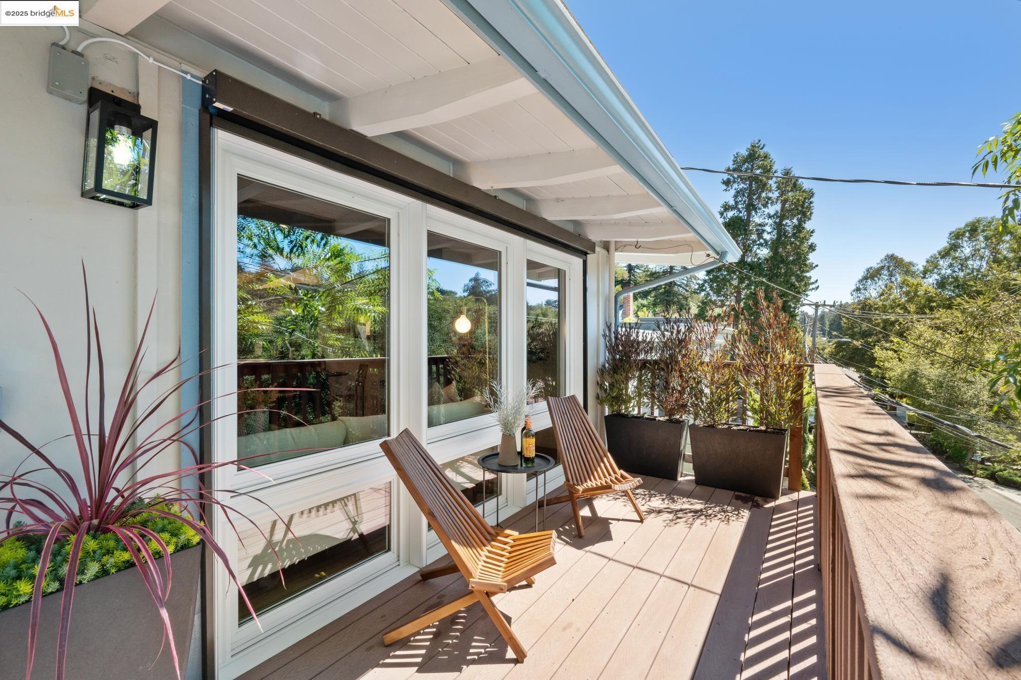 1200 Mountain Boulevard Oakland, CA 94611 - Photo 1 of 1 a living room with patio furniture and a potted plants