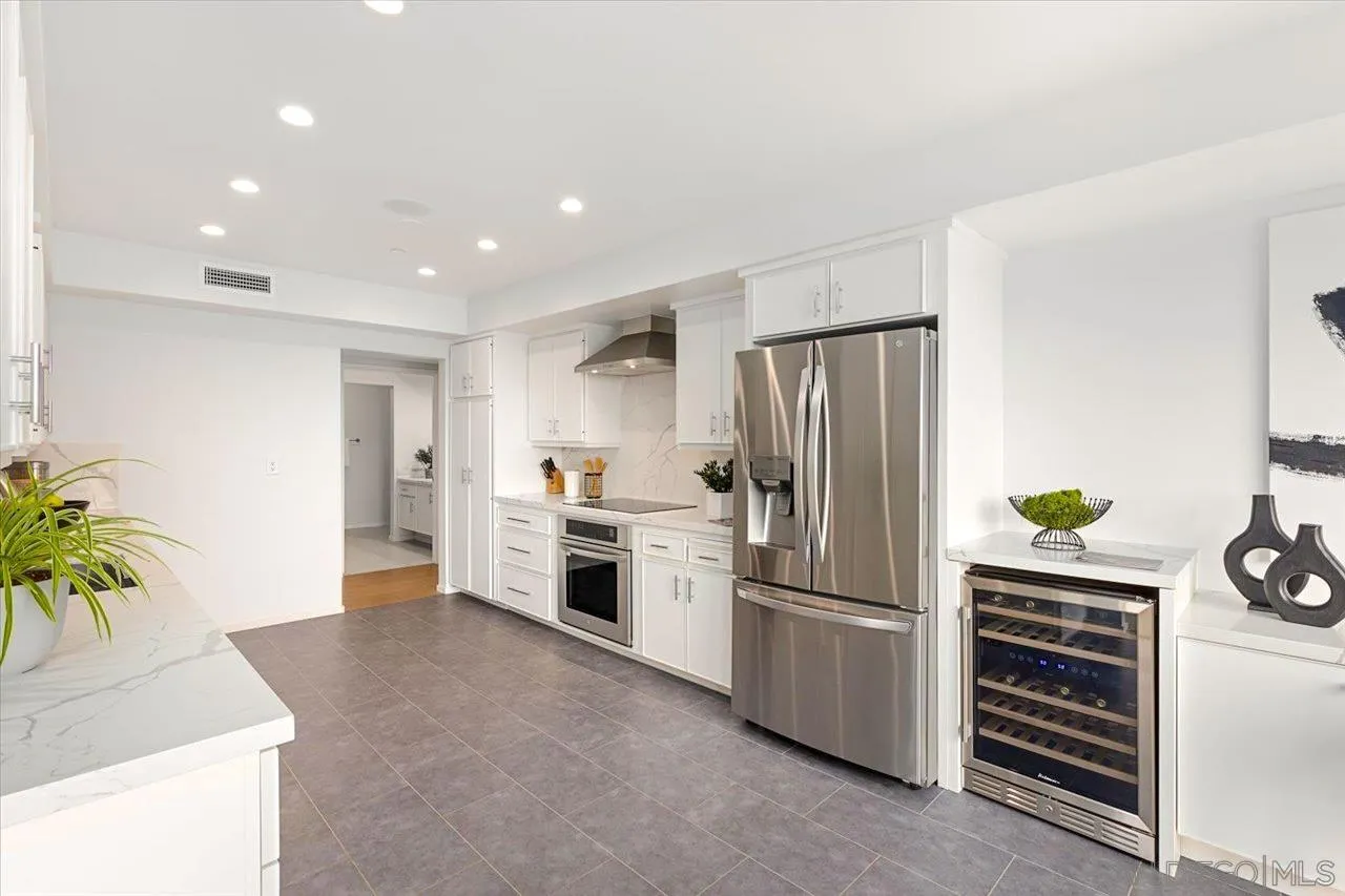 3161 1st Avenue, Unit 3S San Diego, CA 92103 - Photo 19 of 48 a kitchen with a refrigerator and a stove