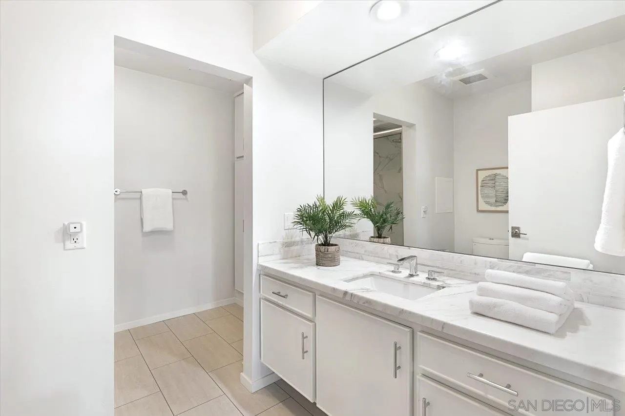 3161 1st Avenue, Unit 3S San Diego, CA 92103 - Photo 35 of 48 a bathroom with a sink and a mirror
