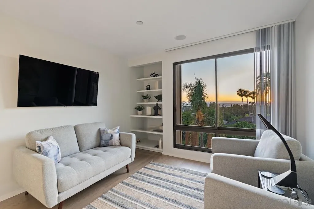 3161 1st Avenue, Unit 3S San Diego, CA 92103 - Photo 8 of 48 a living room with furniture and a flat screen tv