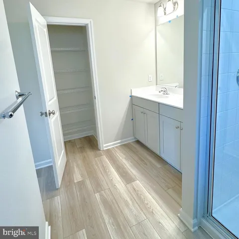 a view of a bathroom from a hallway