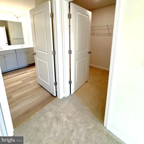 a view of a kitchen from the hallway