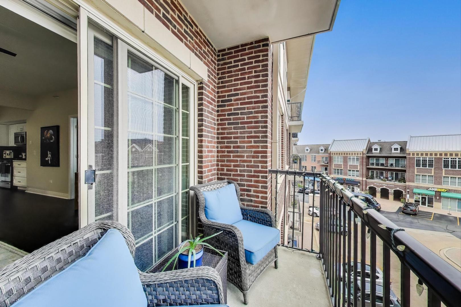 100 South Emerson Street, Unit 415 Mount Prospect, IL 60056 - Photo 13 of 15 a balcony view with a couch