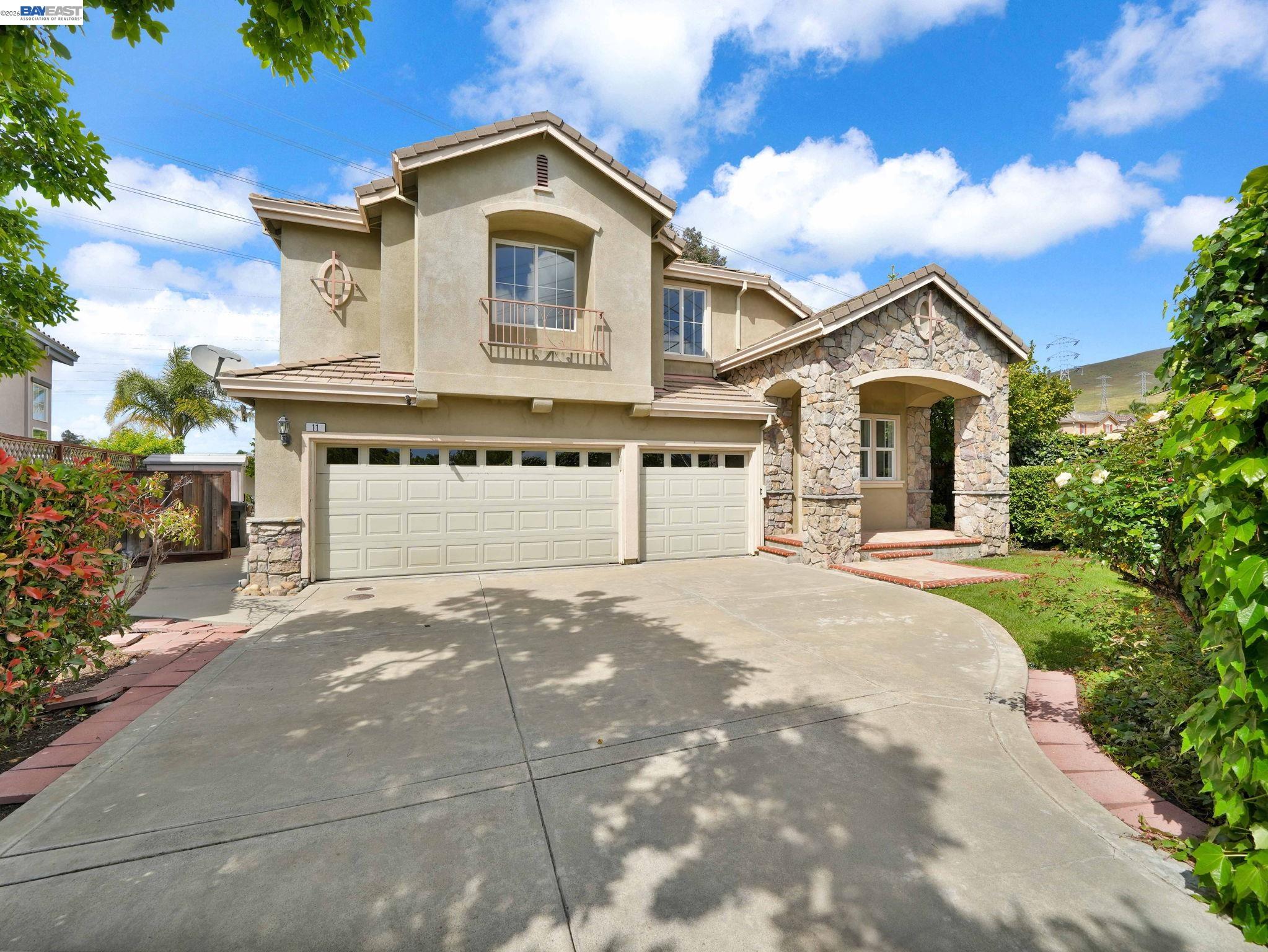 11 Meadows Court Fremont, CA 94539 - Photo 1 of 69 a front view of a house with a yard and garage