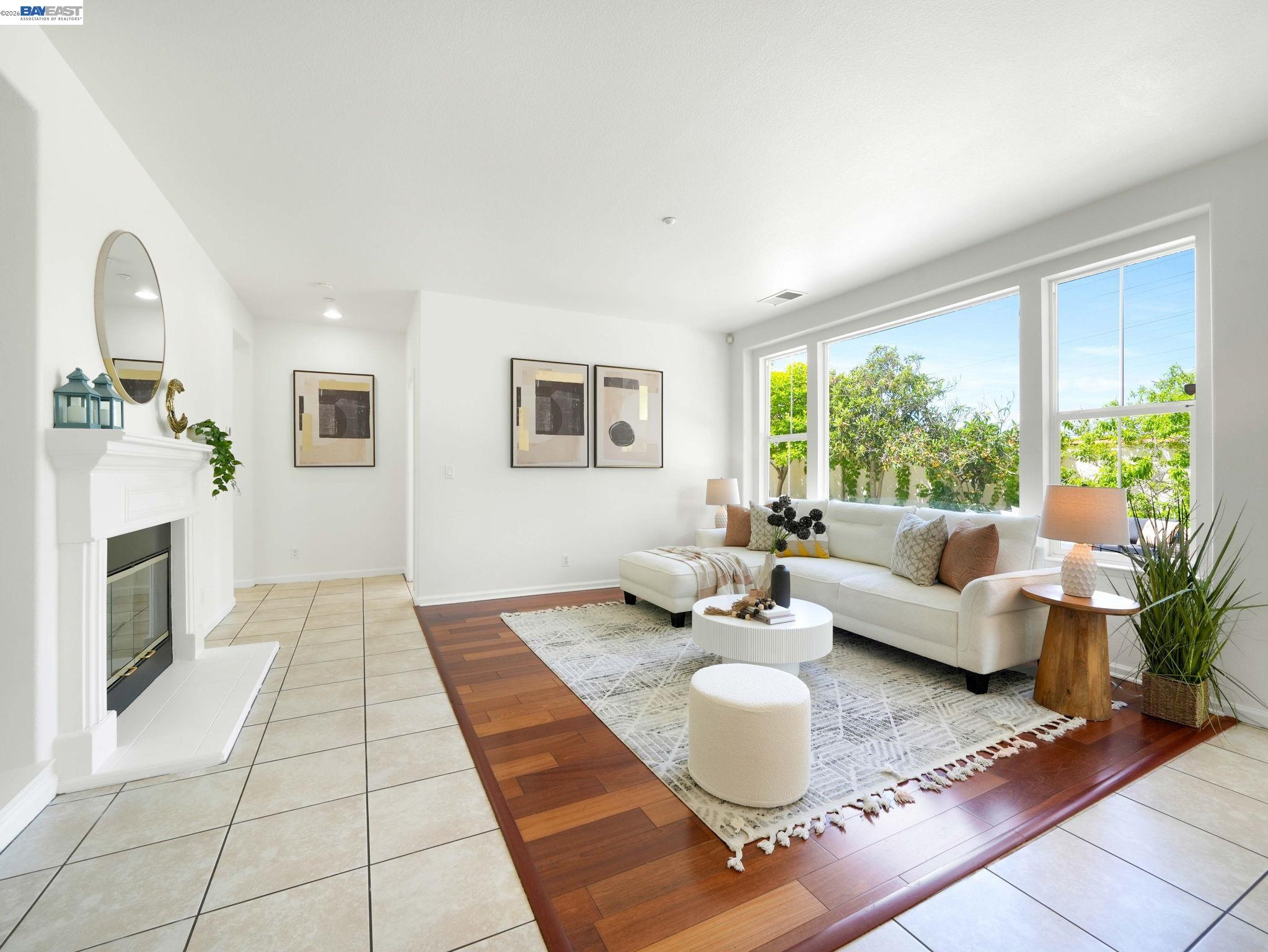 11 Meadows Court Fremont, CA 94539 - Photo 11 of 69 a living room with fireplace furniture and a large window