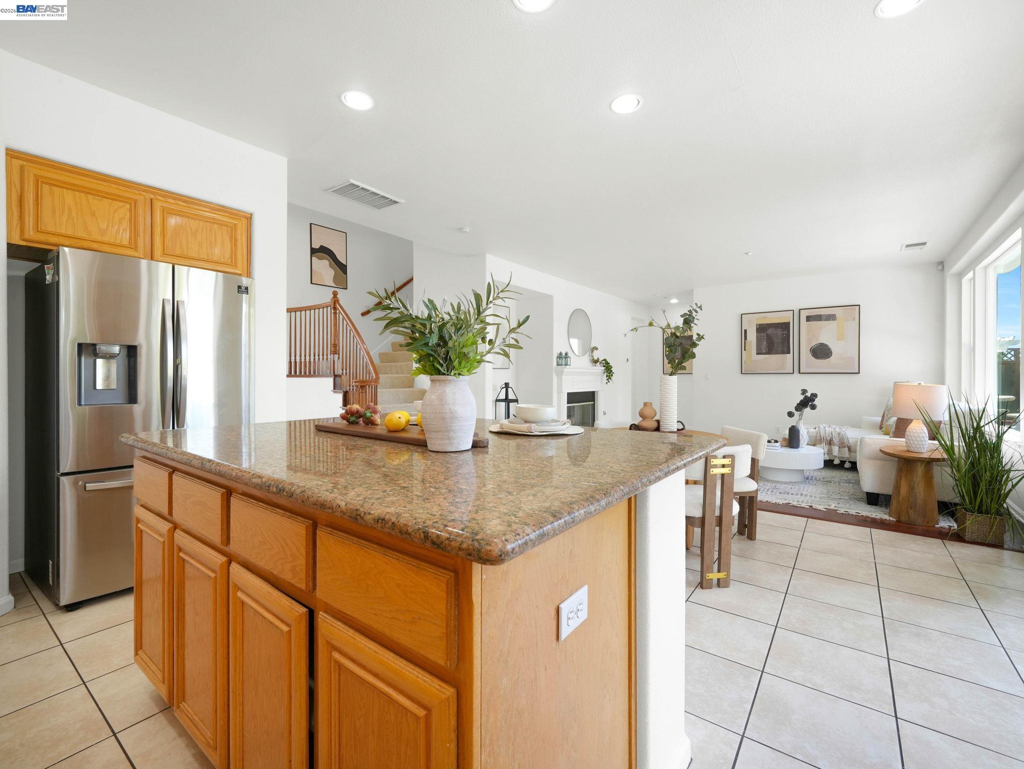 11 Meadows Court Fremont, CA 94539 - Photo 18 of 69 a kitchen with stainless steel appliances granite countertop a refrigerator and a counter space