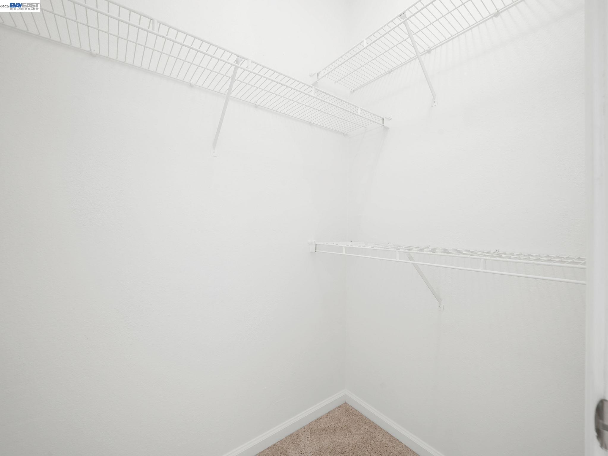 11 Meadows Court Fremont, CA 94539 - Photo 38 of 69 a view of a room with racks on the wall