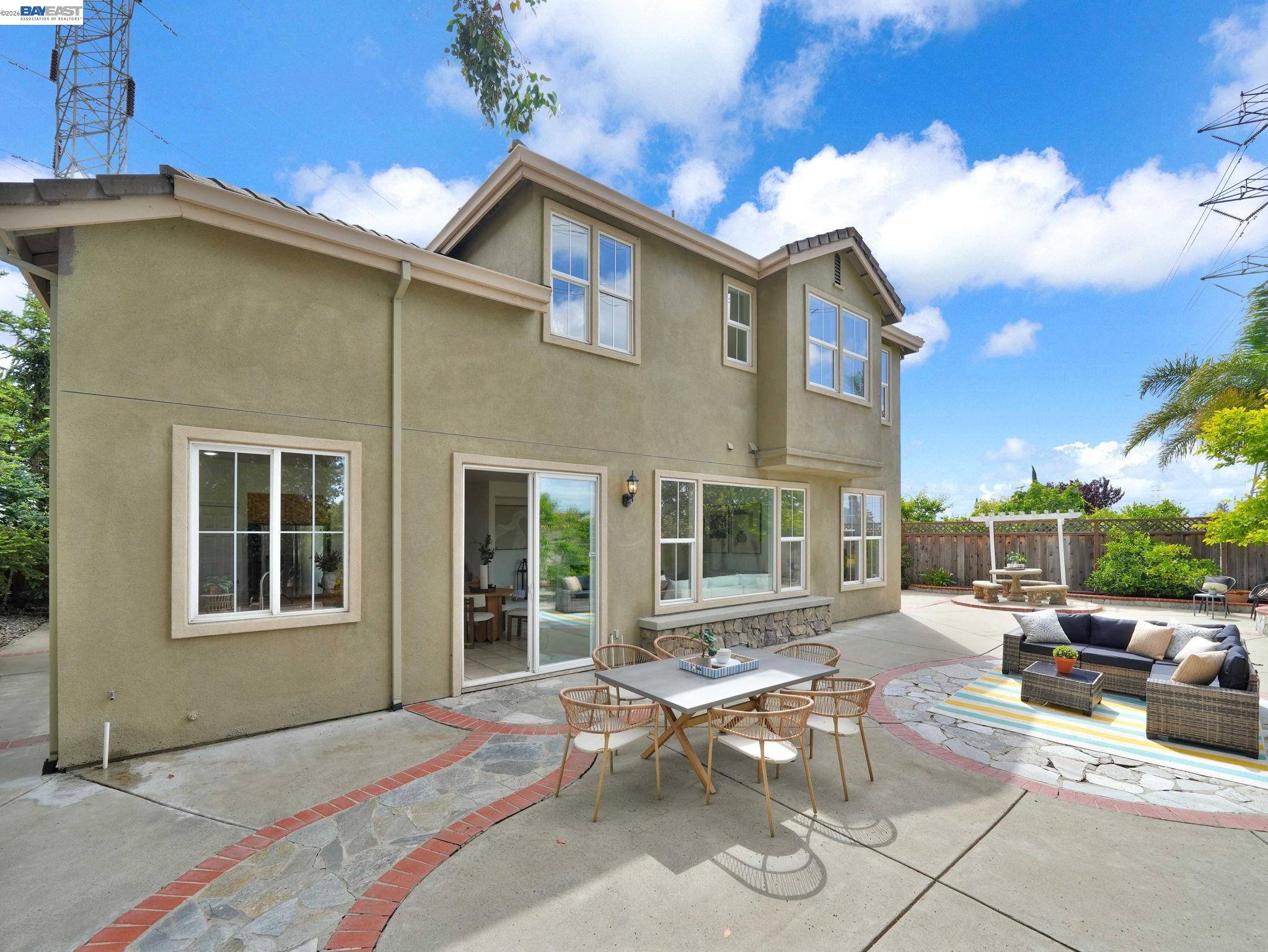 11 Meadows Court Fremont, CA 94539 - Photo 45 of 69 a view of a patio with couches and table and chairs and potted plants
