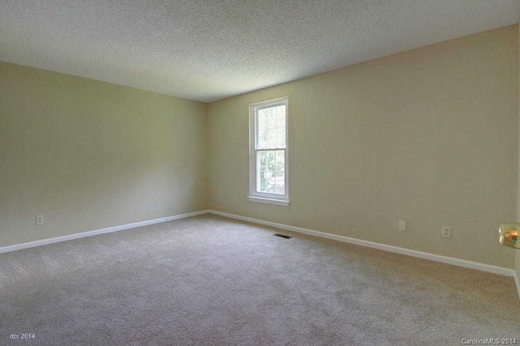 6625 Reddman Road Charlotte, NC 28212 - Photo 11 of 24 an empty room with a window