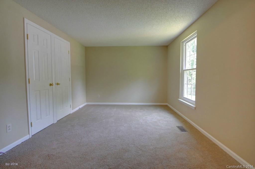 6625 Reddman Road Charlotte, NC 28212 - Photo 12 of 24 a view of an empty room with windows