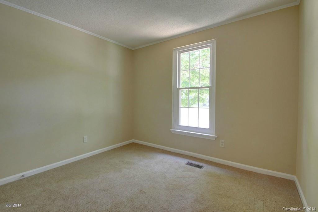 6625 Reddman Road Charlotte, NC 28212 - Photo 14 of 24 an empty room with a window