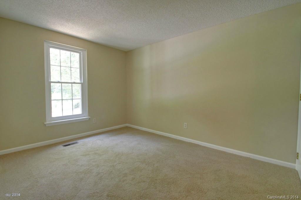 6625 Reddman Road Charlotte, NC 28212 - Photo 15 of 24 an empty room with a window