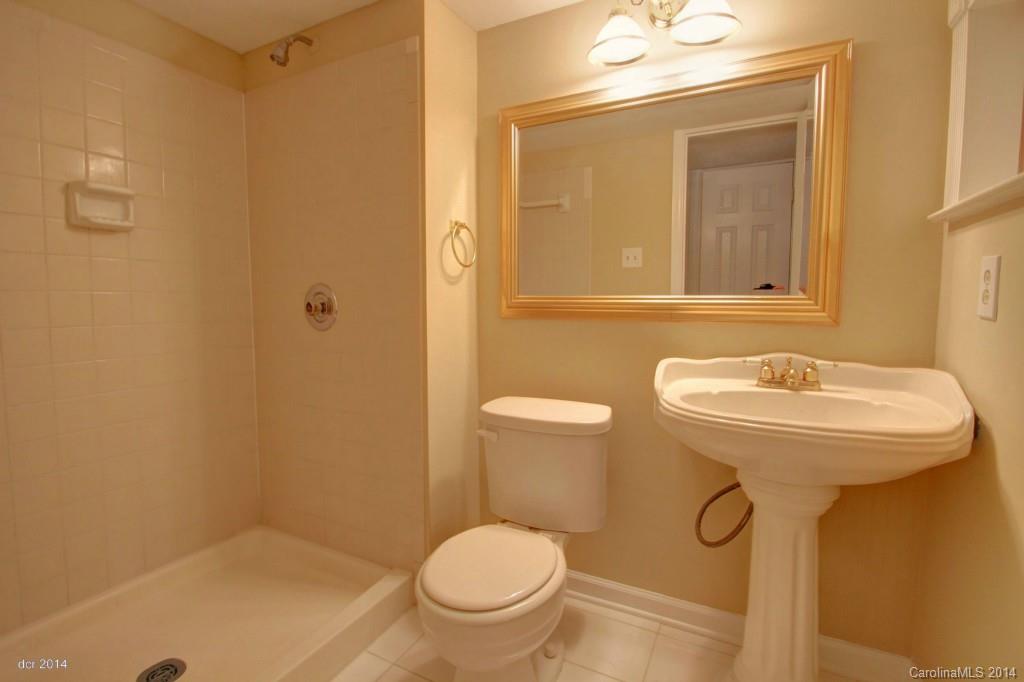 6625 Reddman Road Charlotte, NC 28212 - Photo 17 of 24 a bathroom with a sink toilet and a mirror