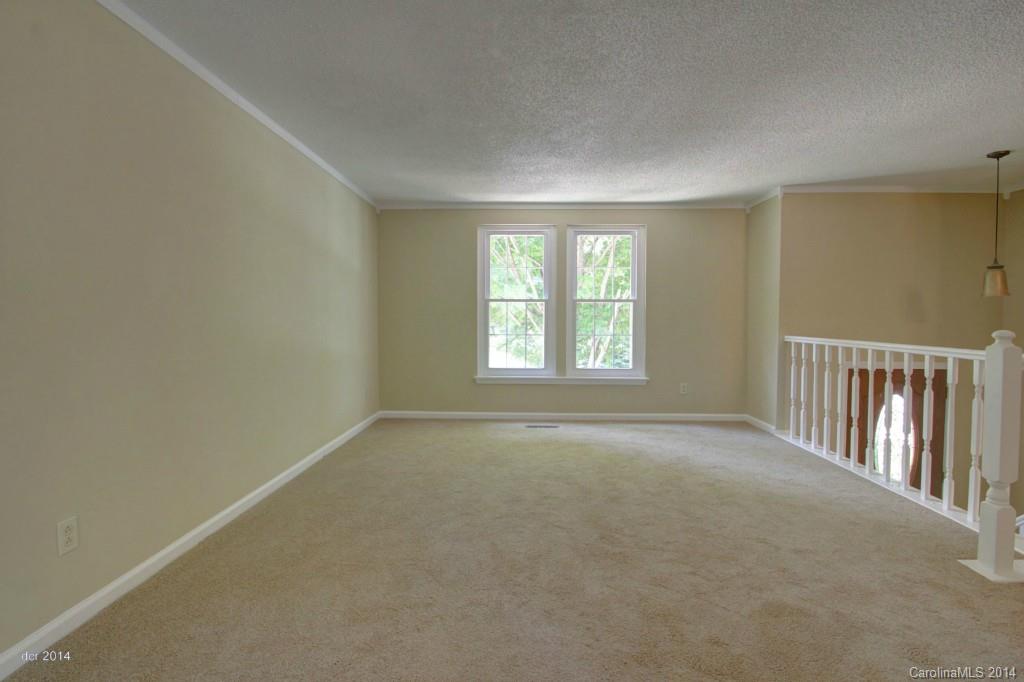 6625 Reddman Road Charlotte, NC 28212 - Photo 7 of 24 an empty room with windows