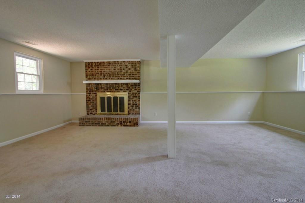 6625 Reddman Road Charlotte, NC 28212 - Photo 9 of 24 an empty room with windows