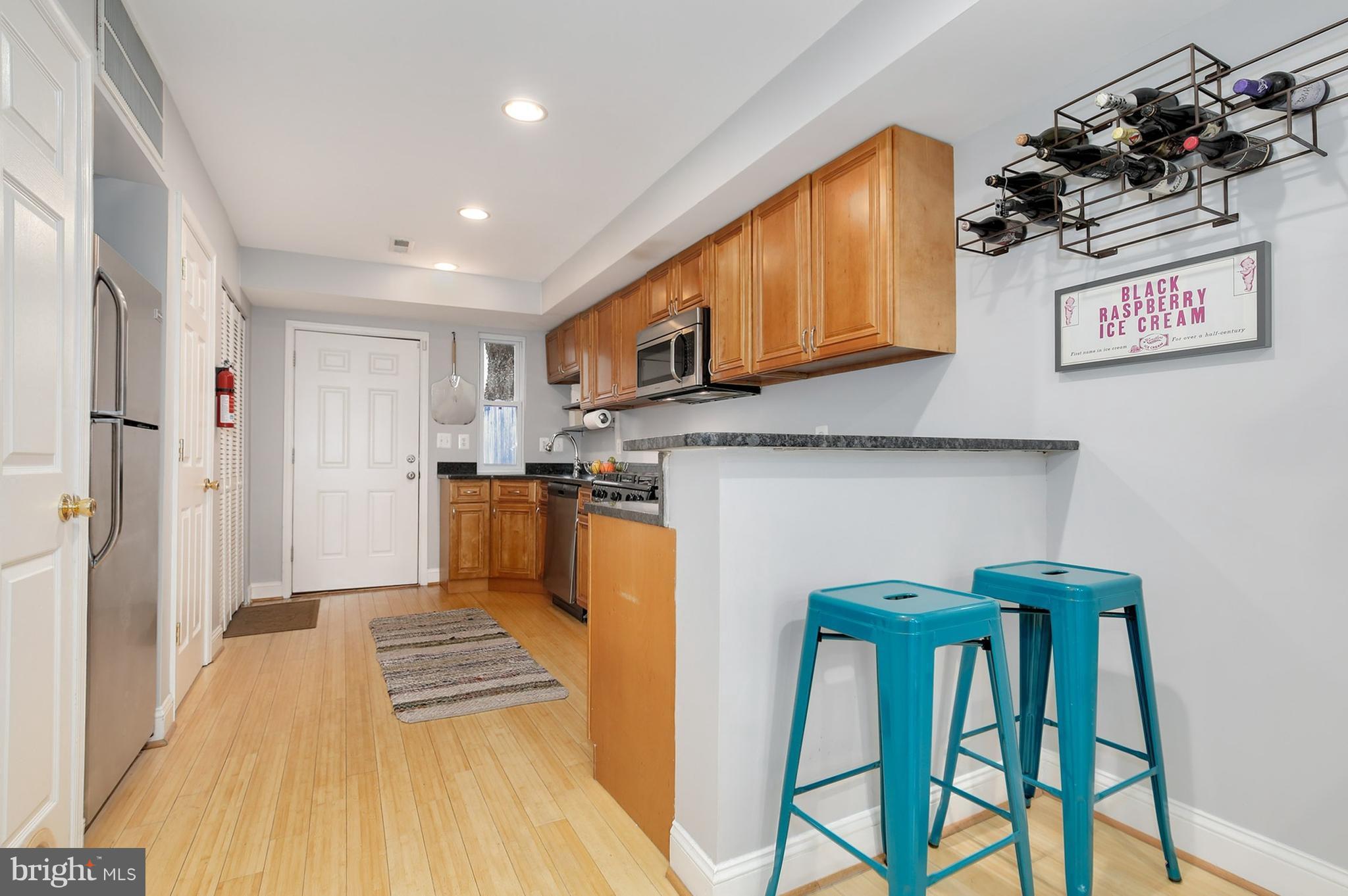 714 19th Street Northeast Washington, DC 20002 - Photo 13 of 27 a view of a kitchen with furniture and wooden floor