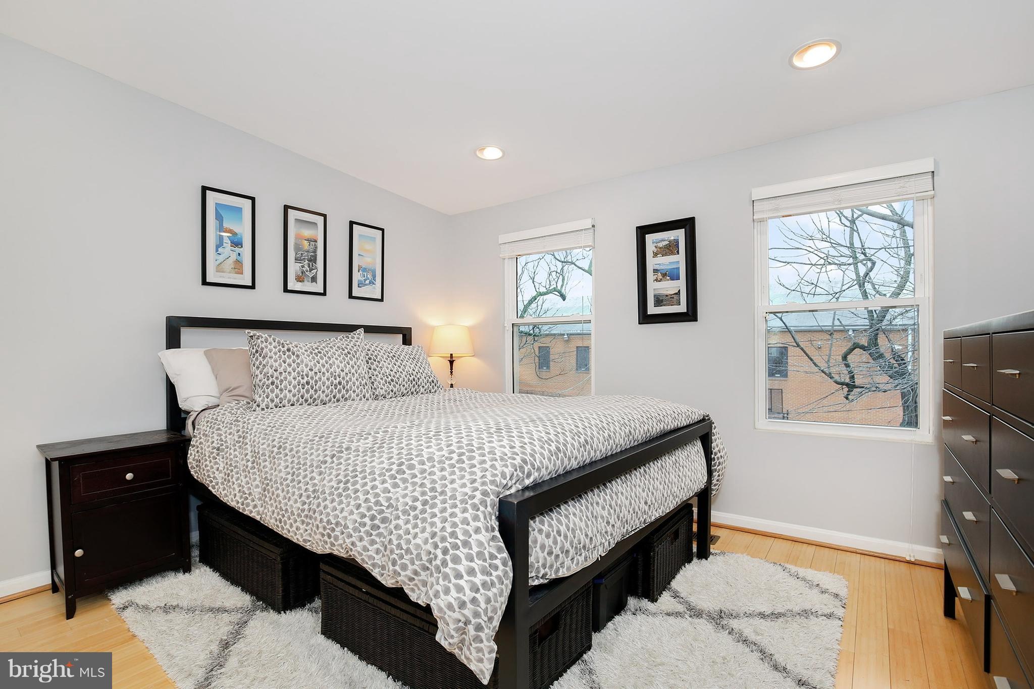 714 19th Street Northeast Washington, DC 20002 - Photo 19 of 27 a bed room with a bed and a tv