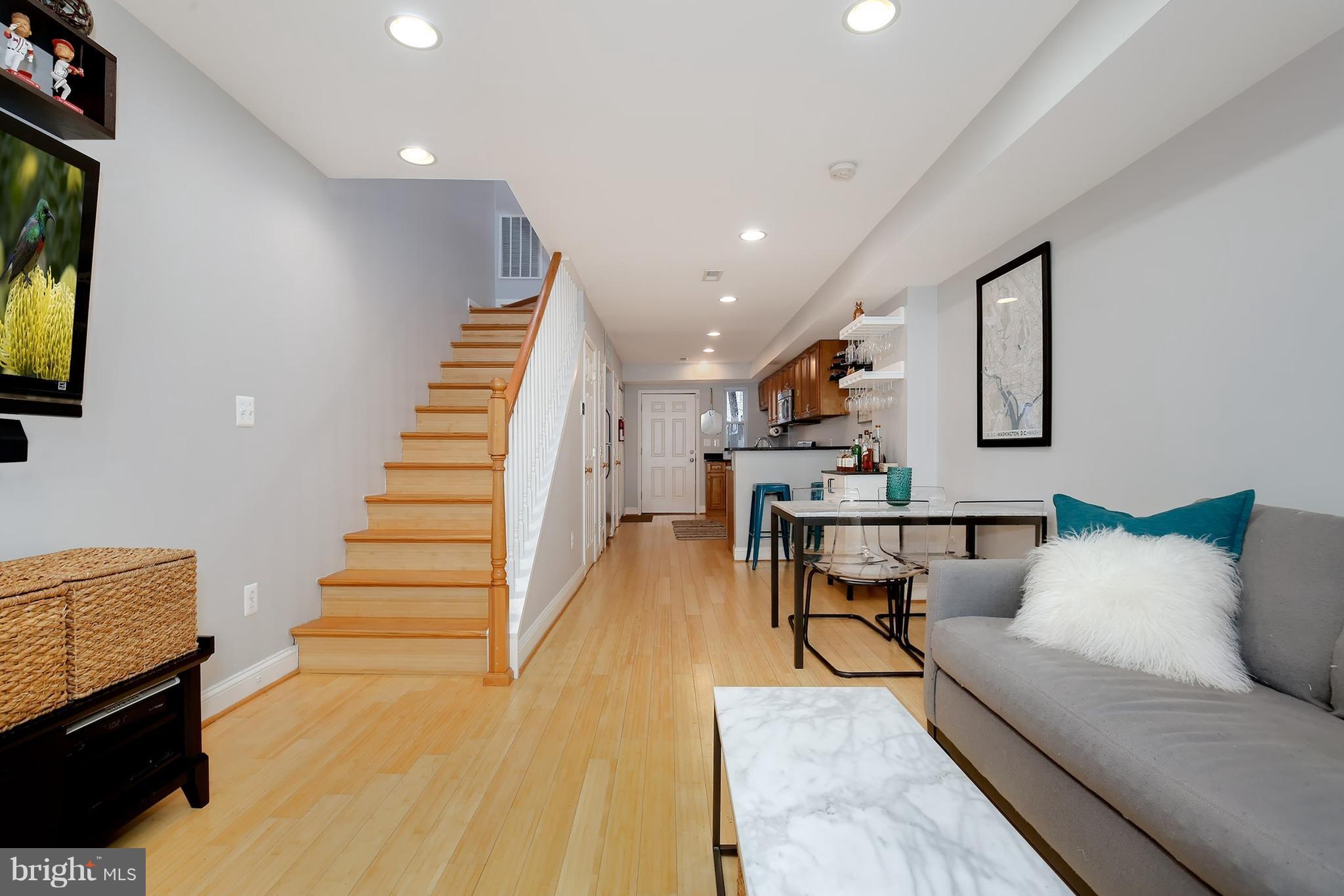 714 19th Street Northeast Washington, DC 20002 - Photo 3 of 27 a living room with furniture and wooden floor