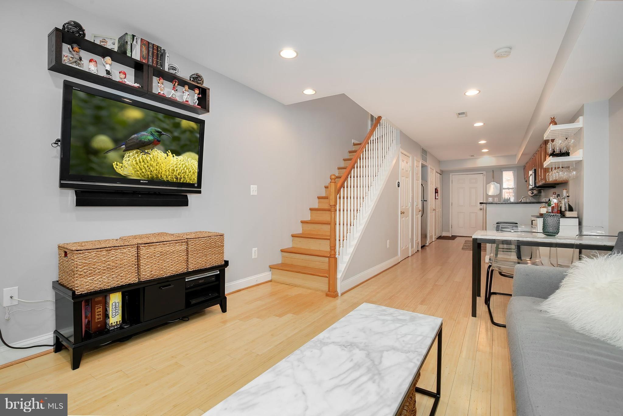 714 19th Street Northeast Washington, DC 20002 - Photo 4 of 27 a living room with furniture and a flat screen tv