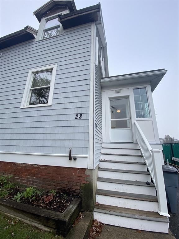22 Harkins Street, Unit L Quincy, MA 02169 - Photo 1 of 15 a view of a house with a yard