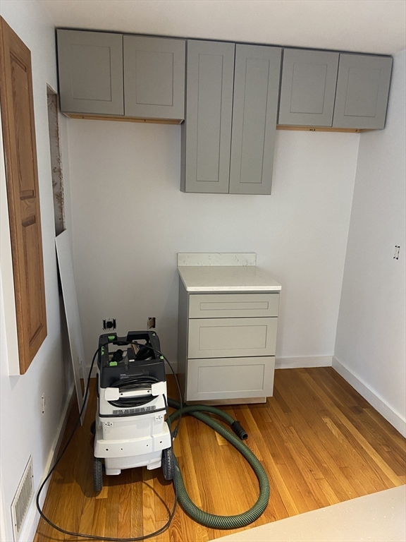 22 Harkins Street, Unit L Quincy, MA 02169 - Photo 14 of 15 a room with storage and utility