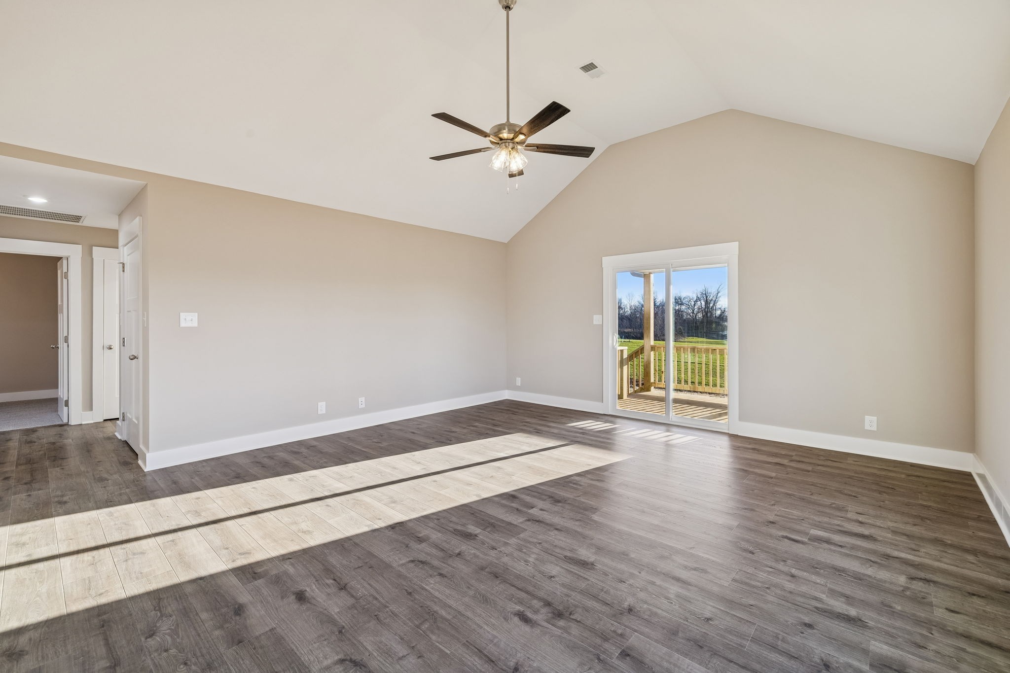 357 Hugh Hunter Road Oak Grove, KY 42262 - Photo 15 of 43 a view of an empty room with window and wooden floor