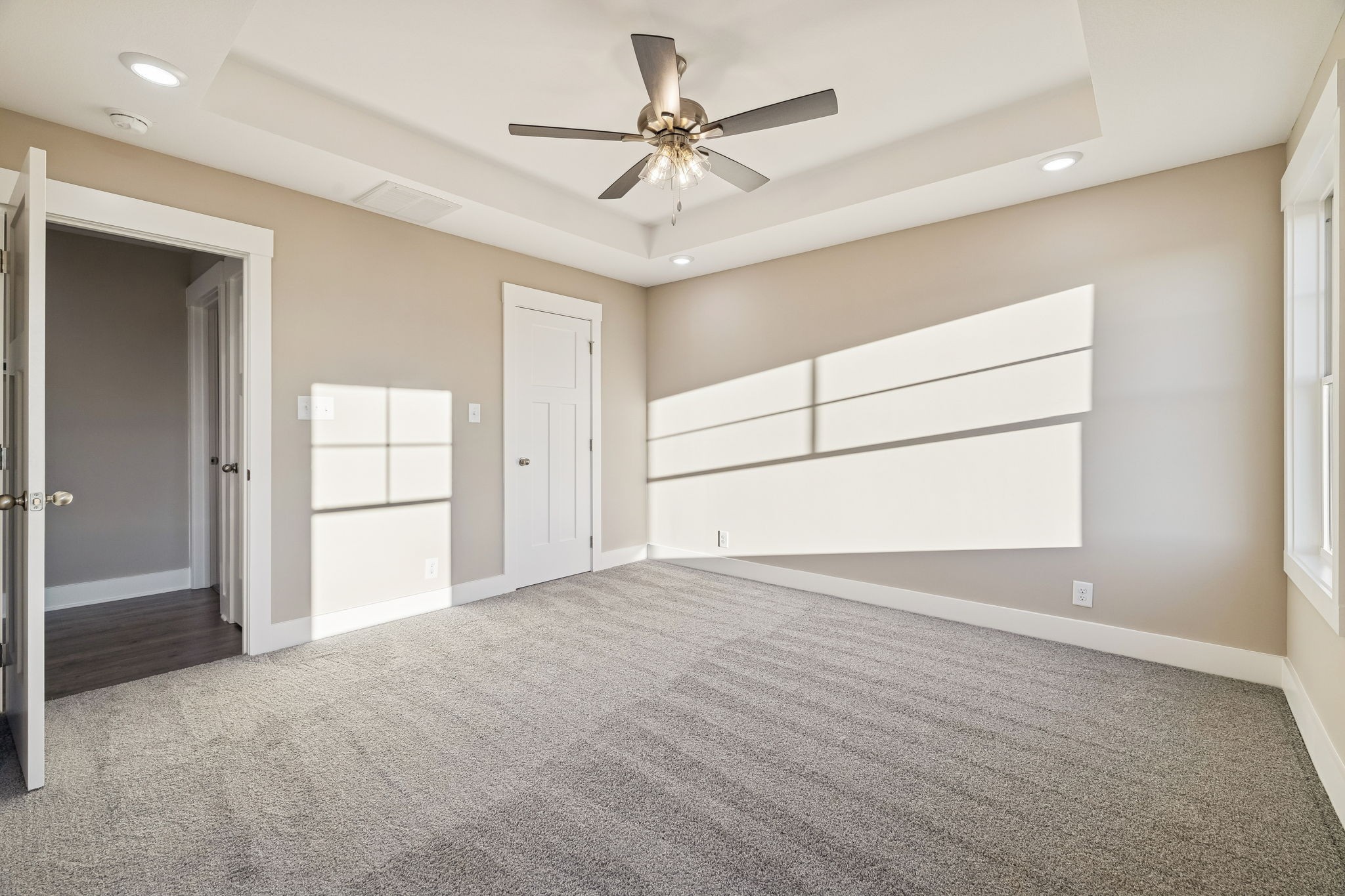 357 Hugh Hunter Road Oak Grove, KY 42262 - Photo 18 of 43 an empty room with chandelier fan and windows