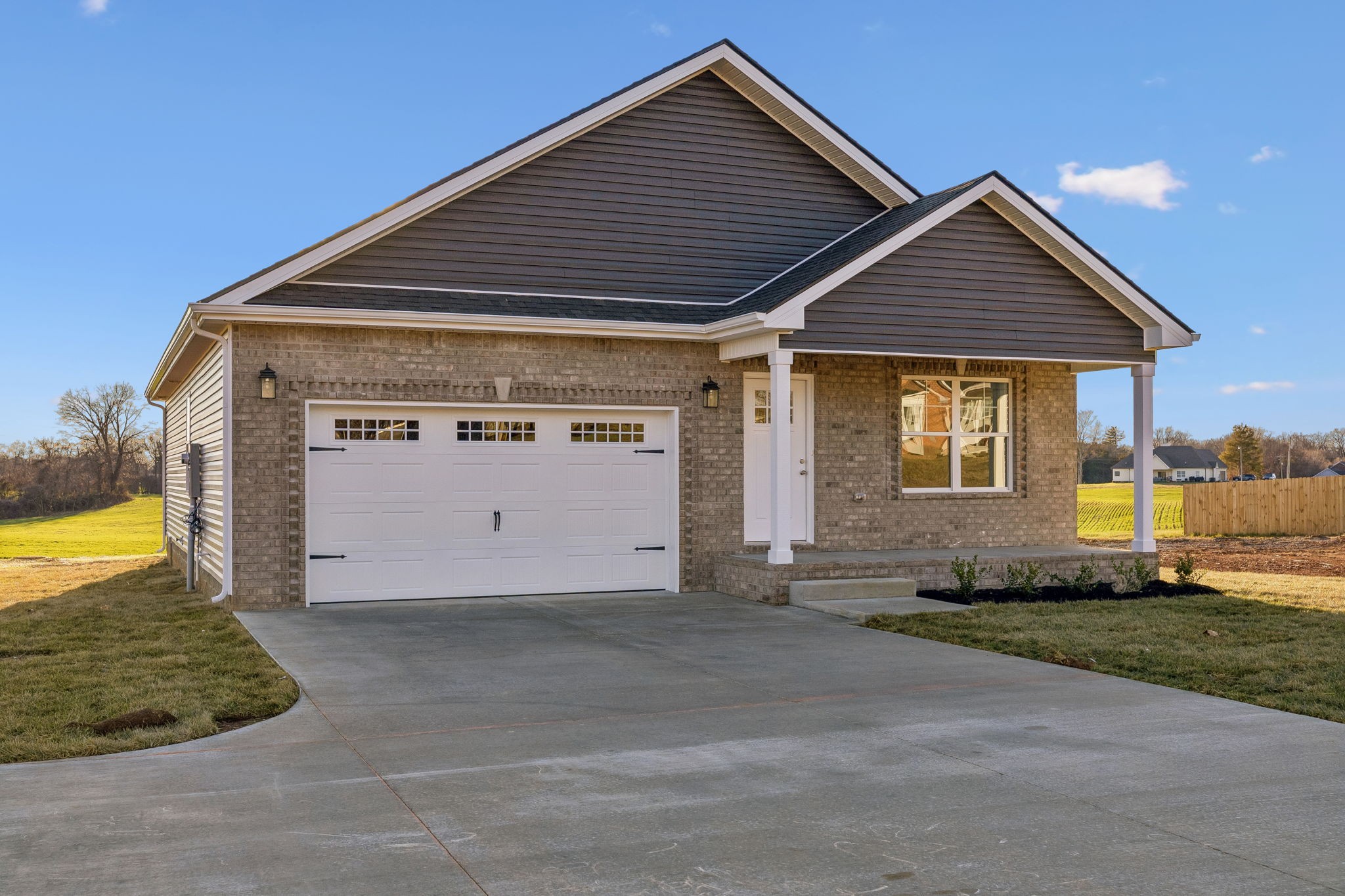 357 Hugh Hunter Road Oak Grove, KY 42262 - Photo 2 of 43 a front view of a house with a yard and garage
