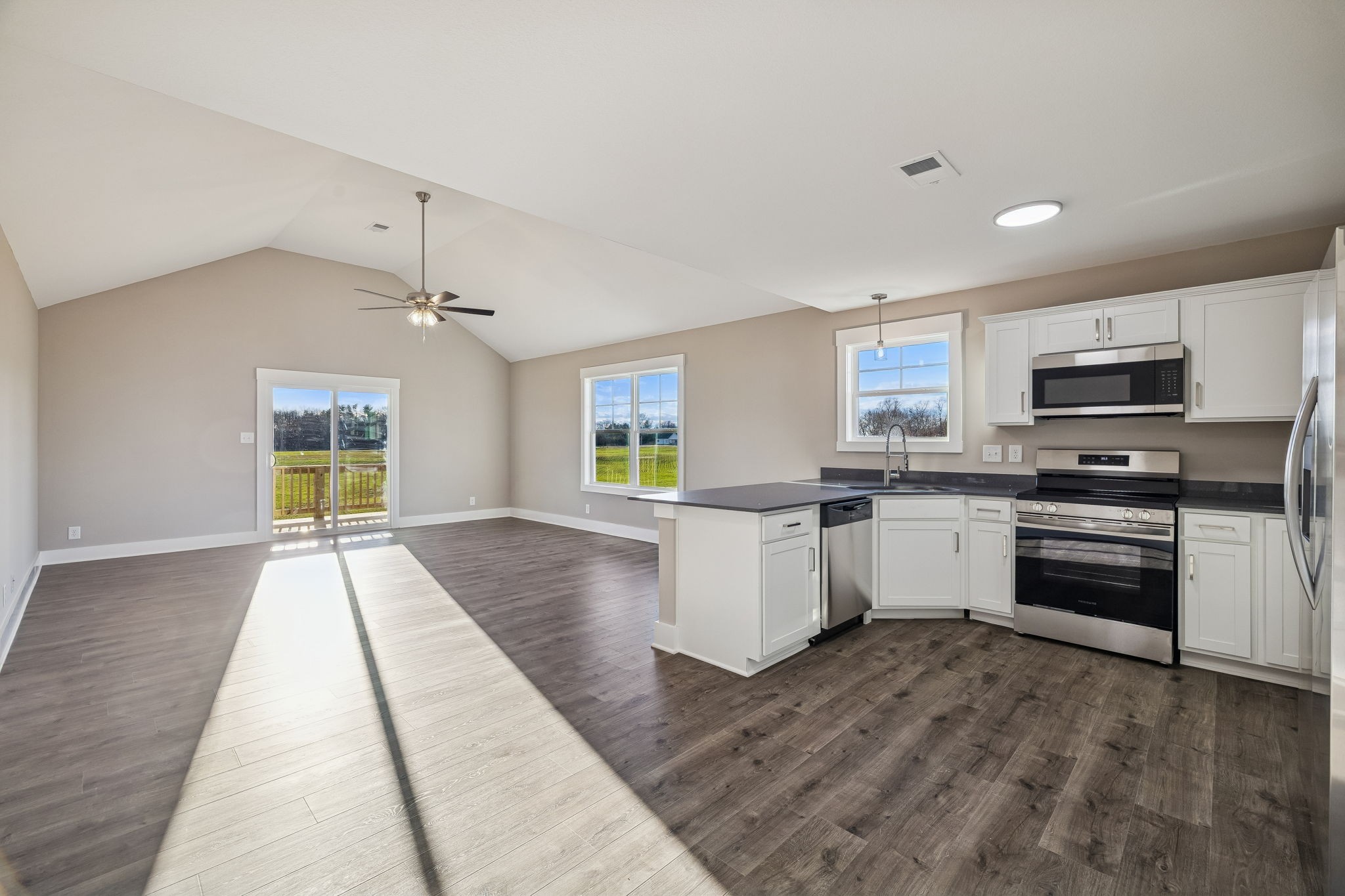 357 Hugh Hunter Road Oak Grove, KY 42262 - Photo 9 of 43 a kitchen with granite countertop a stove and cabinets