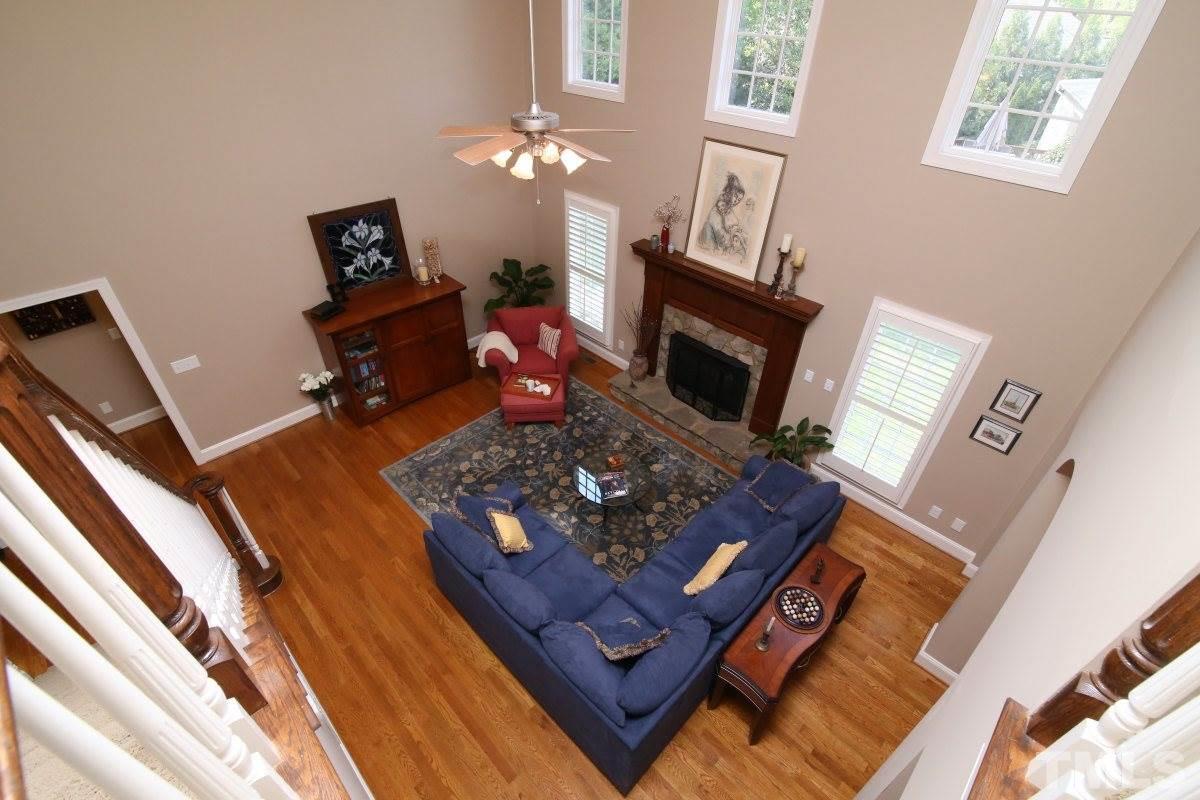 502 Shelley Road Raleigh, NC 27609 - Photo 14 of 25 a living room with furniture and a fireplace