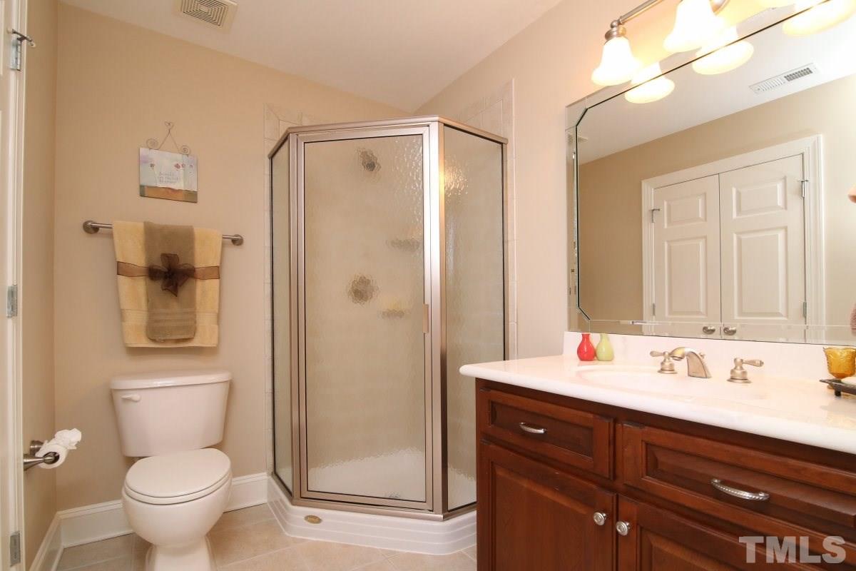 502 Shelley Road Raleigh, NC 27609 - Photo 16 of 25 a bathroom with a sink toilet and shower