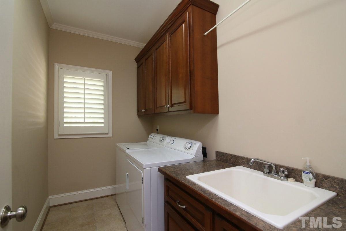 502 Shelley Road Raleigh, NC 27609 - Photo 20 of 25 a utility room with dryer and washer