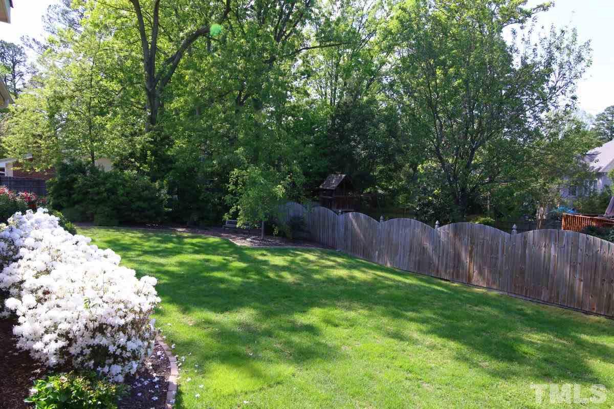 502 Shelley Road Raleigh, NC 27609 - Photo 25 of 25 a backyard of a house with lots of green space