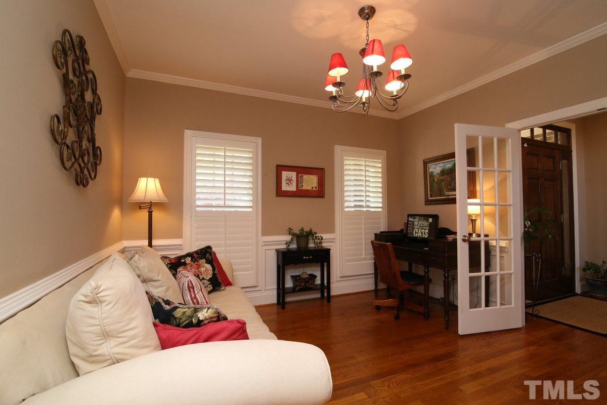502 Shelley Road Raleigh, NC 27609 - Photo 4 of 25 a living room with furniture and wooden floor