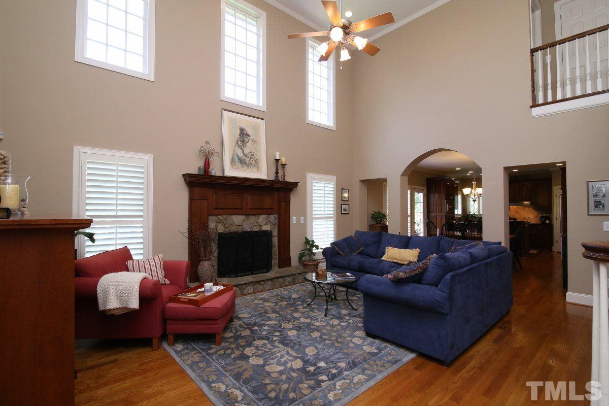 502 Shelley Road Raleigh, NC 27609 - Photo 6 of 25 a living room with furniture and a fireplace