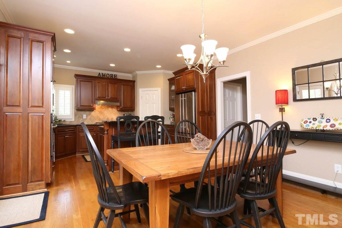 502 Shelley Road Raleigh, NC 27609 - Photo 8 of 25 a view of a dining room with furniture and wooden floor