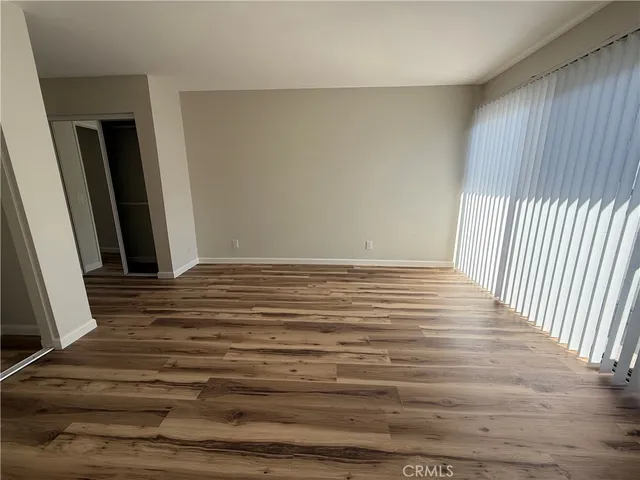 a view of wooden floor with entryway