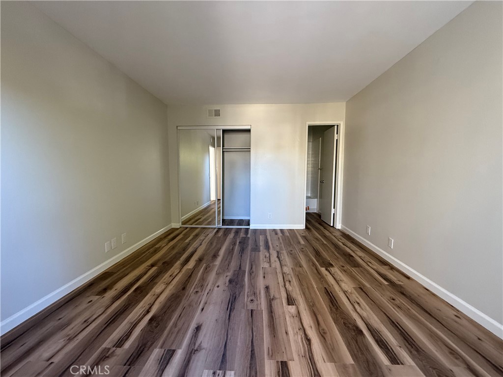 5250 Colodny Drive, Unit 21 Agoura Hills, CA 91301 - Photo 10 of 14 a view of a room with wooden floor