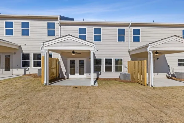 a view of a house with wooden floor and a yard