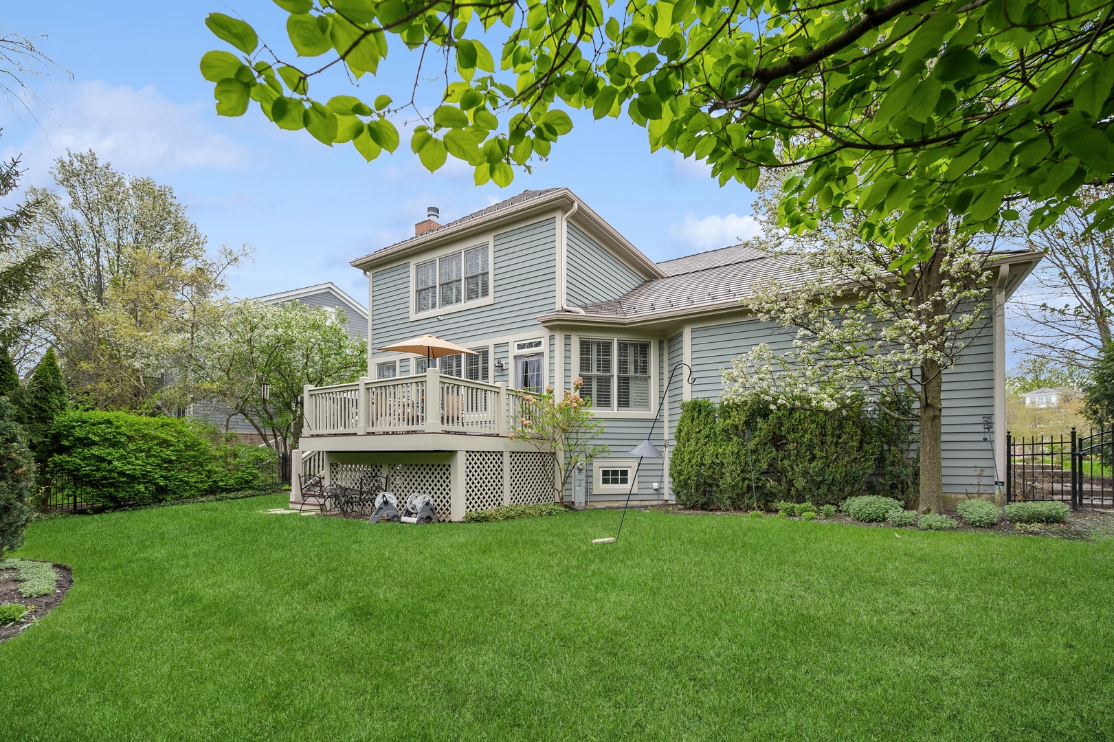 1437 Kittyhawk Lane Glenview, IL 60026 - Photo 20 of 24 a front view of a house with a garden and yard